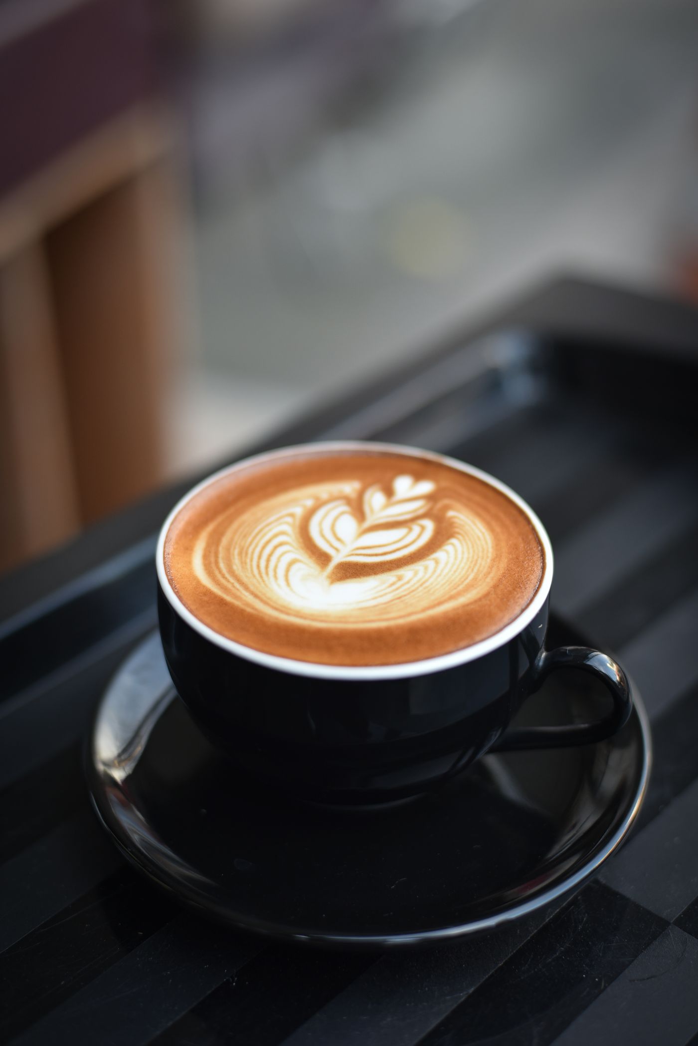 Close-up of a kopi cup on the counter